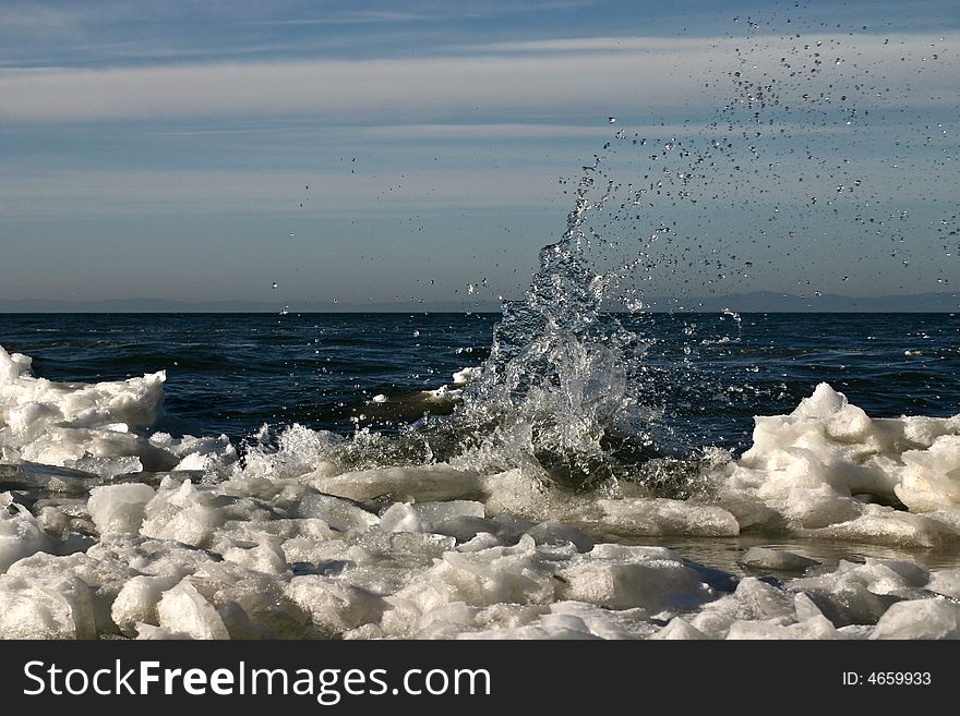 Shower on the ice in the baikal lake in winter