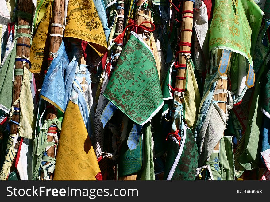 A lot of buddhist flags tied to poles in siberia named imorin