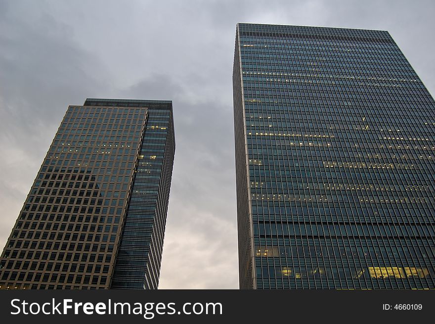 London Canary Wharf skycraper with a cloudy sky. London Canary Wharf skycraper with a cloudy sky