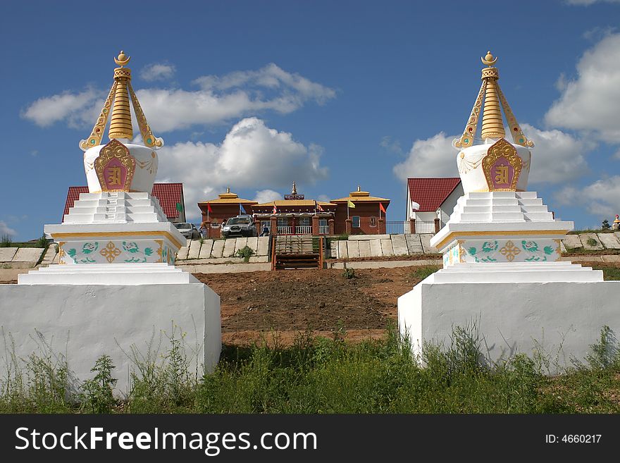 White stppa in front of a buddhist temple in siberia. White stppa in front of a buddhist temple in siberia