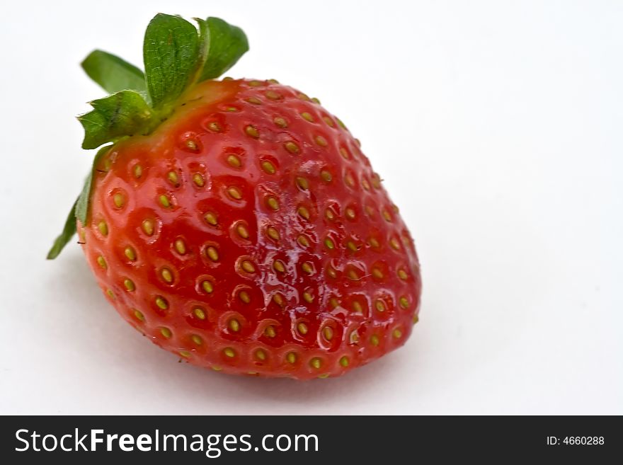 One isolated  fresh strawberry on white background. One isolated  fresh strawberry on white background