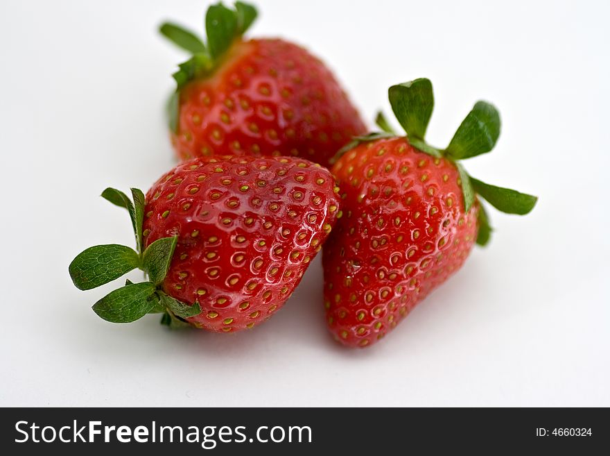 Three strawberries on white background, isolated