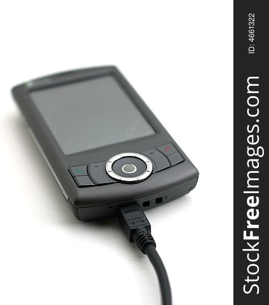 Isolated HTC phone with USB cable. Isolated HTC phone with USB cable