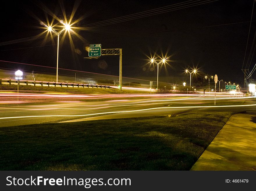 Long camera exposure making streaming lights across the road. Long camera exposure making streaming lights across the road.