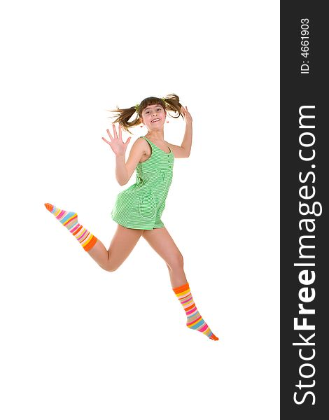 Happy girl is jumping over white background
