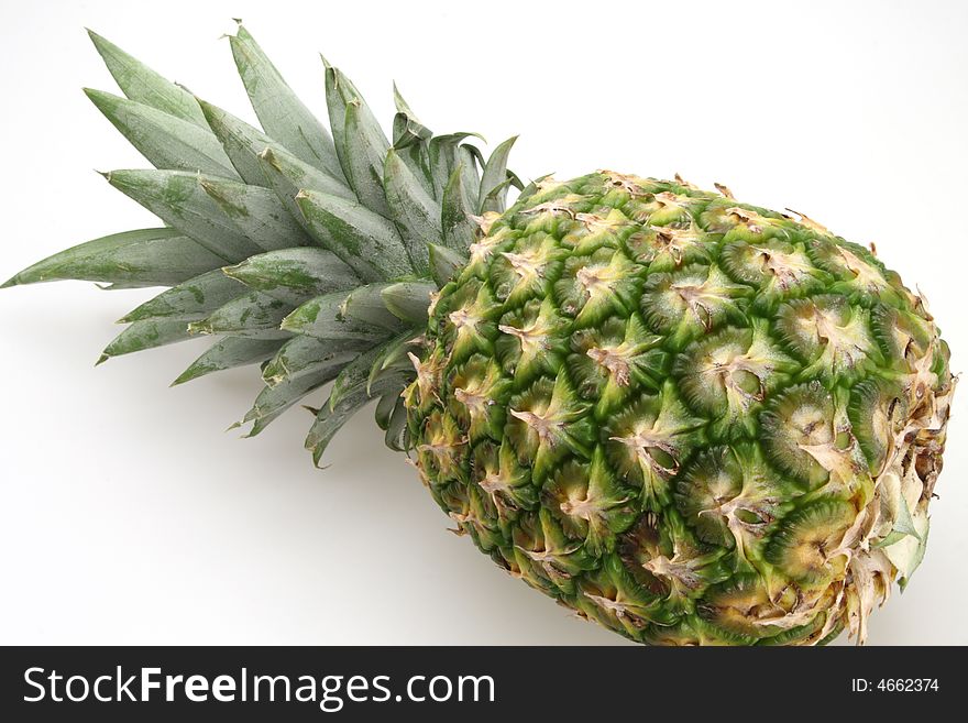 Fresh pineapple ready to be sliced for desert or salad