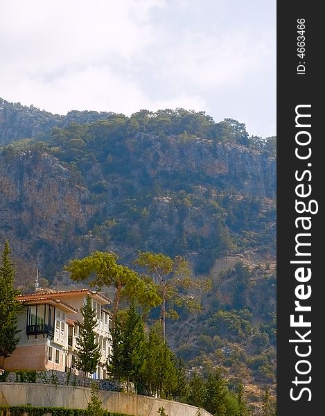 View on a bungalow located at the rock with great mountain on background