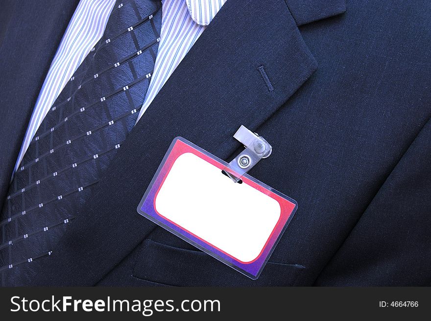 Photo of businessman with empty badge. Photo of businessman with empty badge