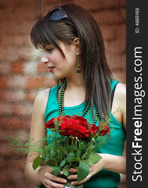 Beautiful girl with red roses