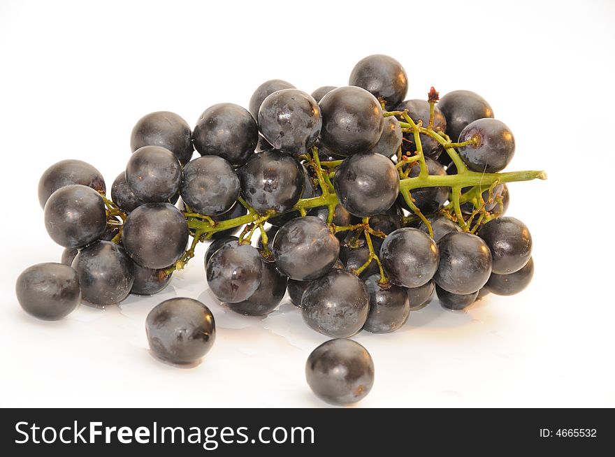 Bunch of the black grapes, isolated on a white background. Bunch of the black grapes, isolated on a white background