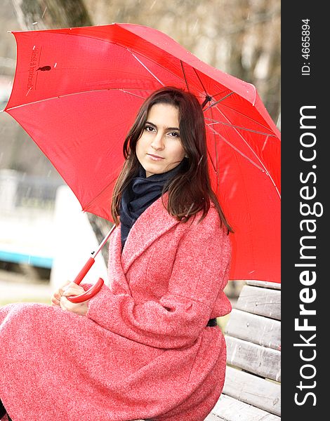 The girl with a red umbrella