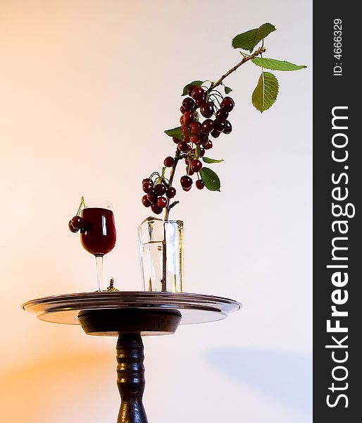 Object abstract,arangement cherry in vase to stand.