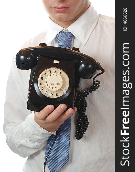 Business man holding an old fashion telephone isolated