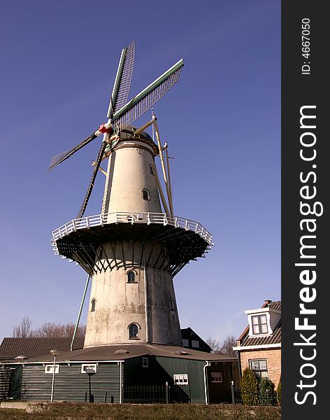 A blue sky and a restored corn-mill. A blue sky and a restored corn-mill