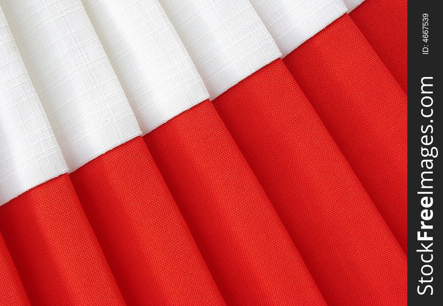 Red and white abstract folded fabric background. Red and white abstract folded fabric background