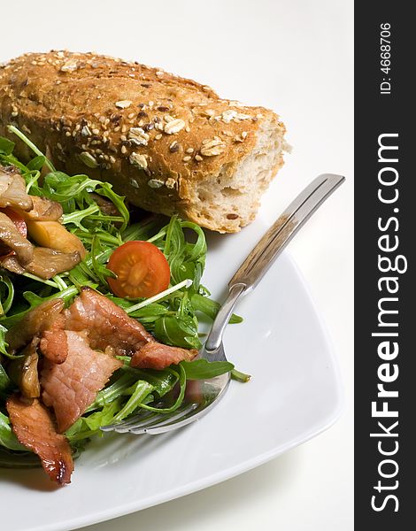 Rocket salad with ham and mushrooms and baguette. Rocket salad with ham and mushrooms and baguette