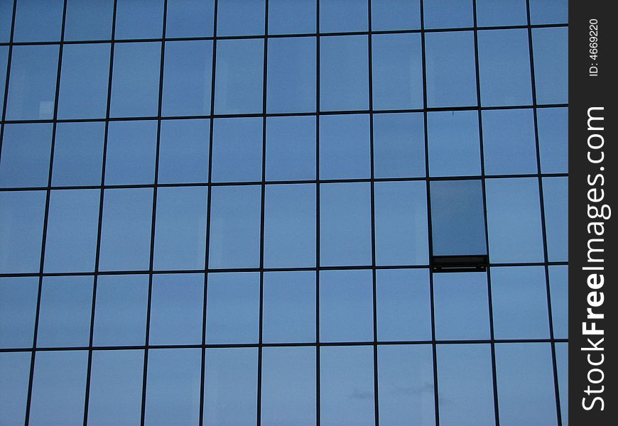 View of rectangular blue glass mirroring windows. View of rectangular blue glass mirroring windows.
