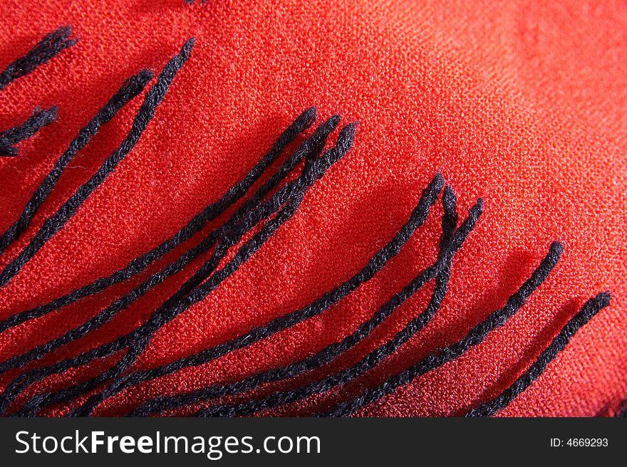 Brushes on a background of a textile cloth from a wool of red color. Brushes on a background of a textile cloth from a wool of red color