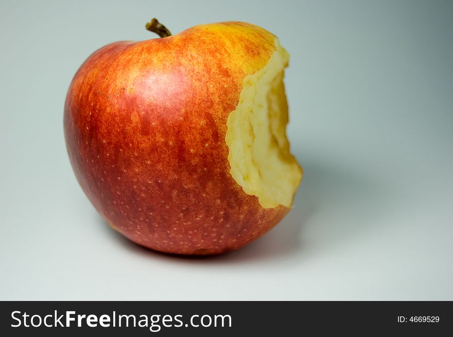 Bite of apple. Fresh, red and beautiful apple on white background.