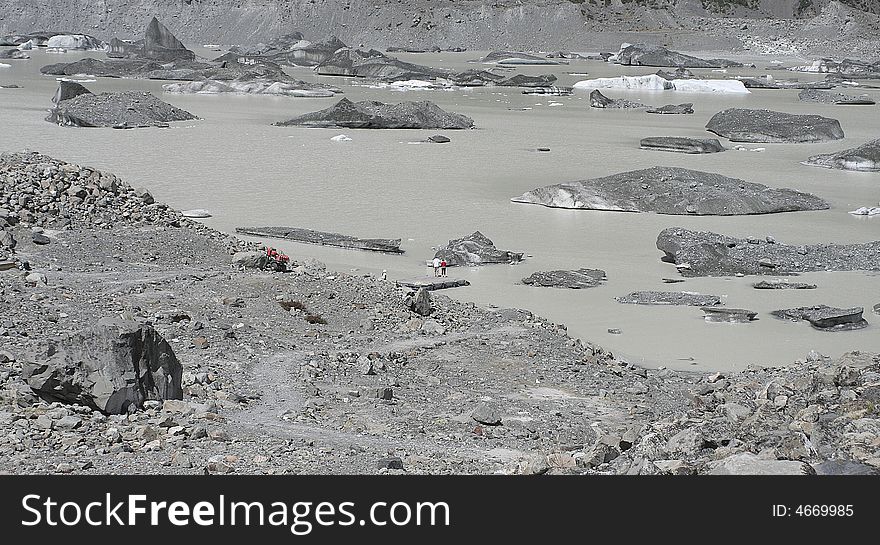 Glacial Iceberg Floating On Melt Lake.