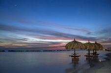 Umbrellas In The Ocean At Sunset Royalty Free Stock Photos Umbrellas In The Ocean At Sunset Royalty Free Stock Photos