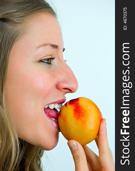 Smiling Girl Eating A Peach