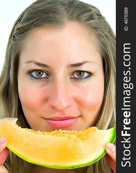 Close-up portrait of a girl with yellow melon. Close-up portrait of a girl with yellow melon