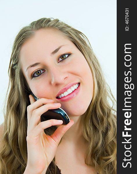 Smiling pretty lady talking to a mobile telephone. Smiling pretty lady talking to a mobile telephone