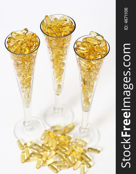 Three glasses with gold boluses