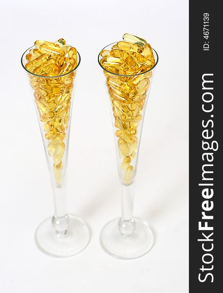 Two glasses with gold boluses