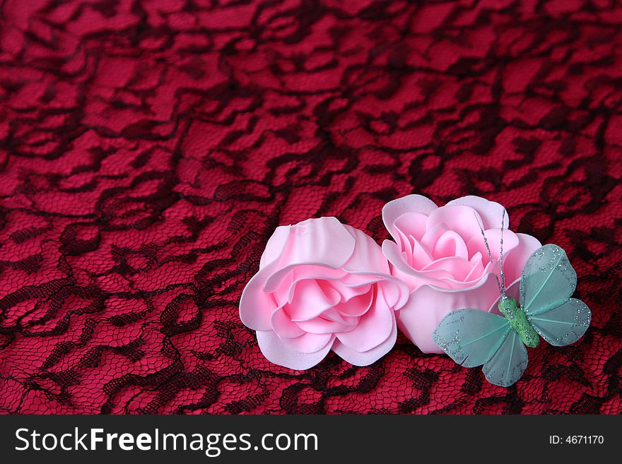 Pink flowers made out of soap and a butterfly. Pink flowers made out of soap and a butterfly