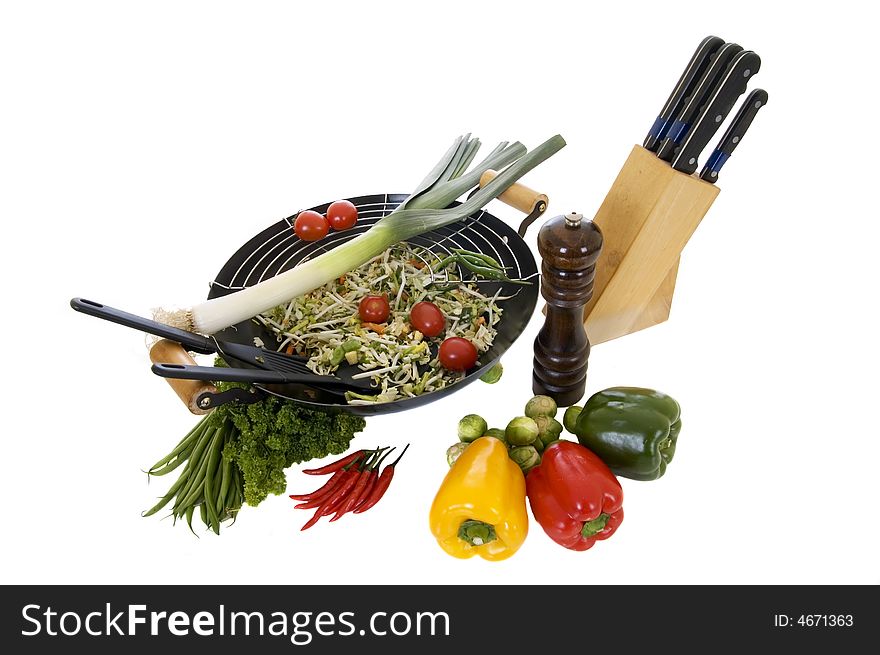 Preparing wok with fresh vegetables on cuttingboard, white background,