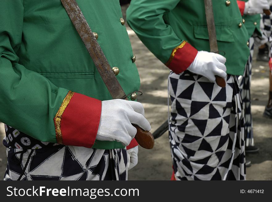 The row of tropper kingdom with sword and green uniform at central java, Indonesia. The row of tropper kingdom with sword and green uniform at central java, Indonesia