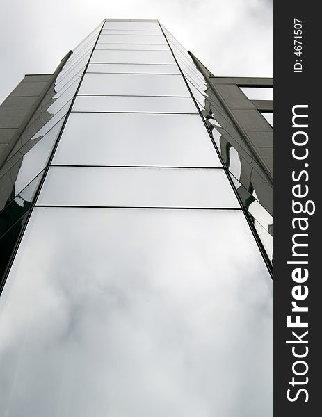 Modern glossy building perspective with sky reflections. Modern glossy building perspective with sky reflections