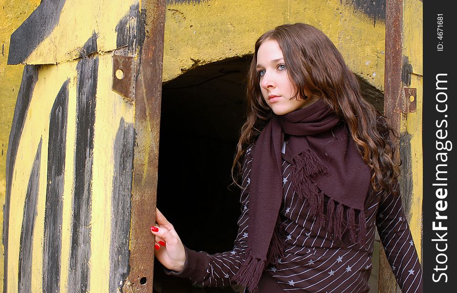 Teenage girl opening old painted gates. Teenage girl opening old painted gates