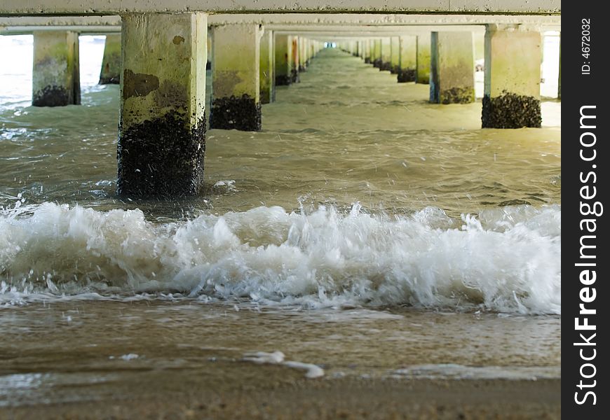 The sea under the jetty at low tide. The sea under the jetty at low tide