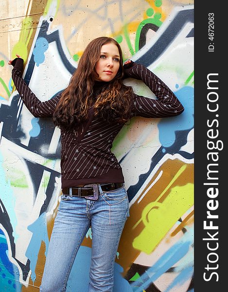 Girl near the graffiti wall