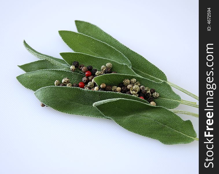 Herbal leaves with different colored dried spices. Herbal leaves with different colored dried spices