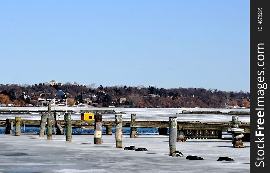 Icy morning at an empty marina in winter. Icy morning at an empty marina in winter.