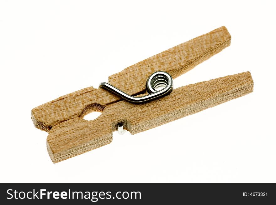 One isolated wooden clothespin (peg). One isolated wooden clothespin (peg)