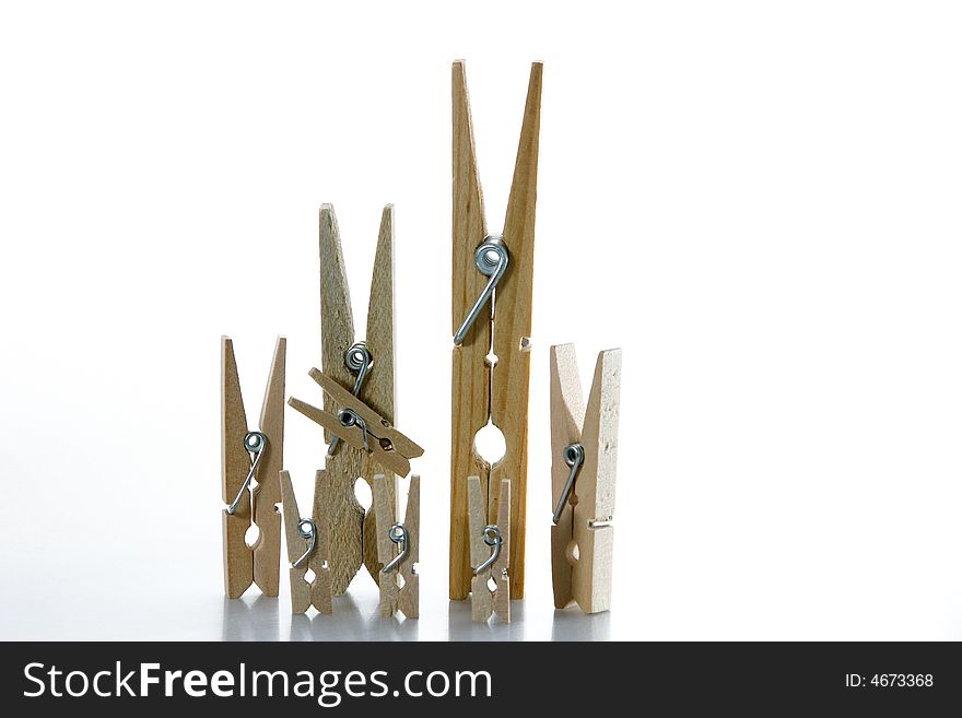 A wooden clothespin family (2 parents and 6 children). A wooden clothespin family (2 parents and 6 children)