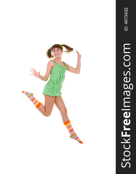 Happy girl is jumping over white background