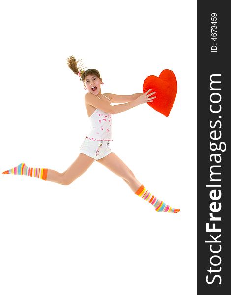 Happy girl is jumping with heart over white background