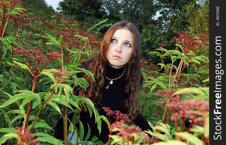 Teenage girl in high grass alone