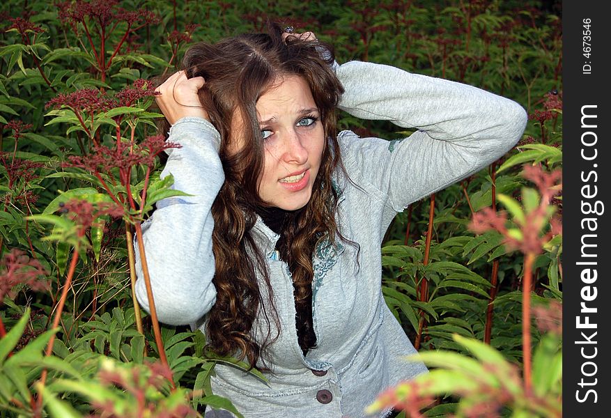 Teenage girl in high grass alone