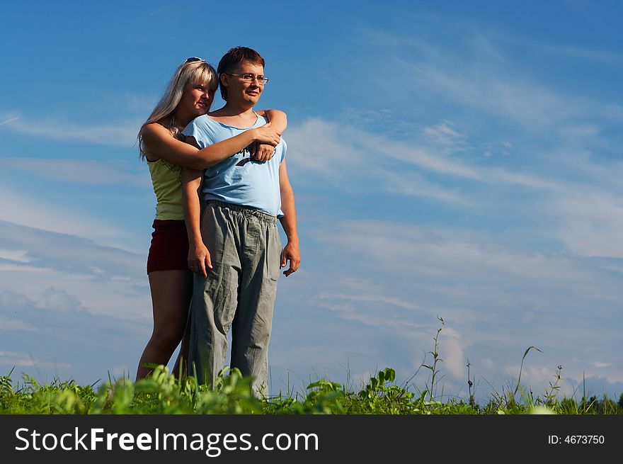 Couple woman and man under blue sky