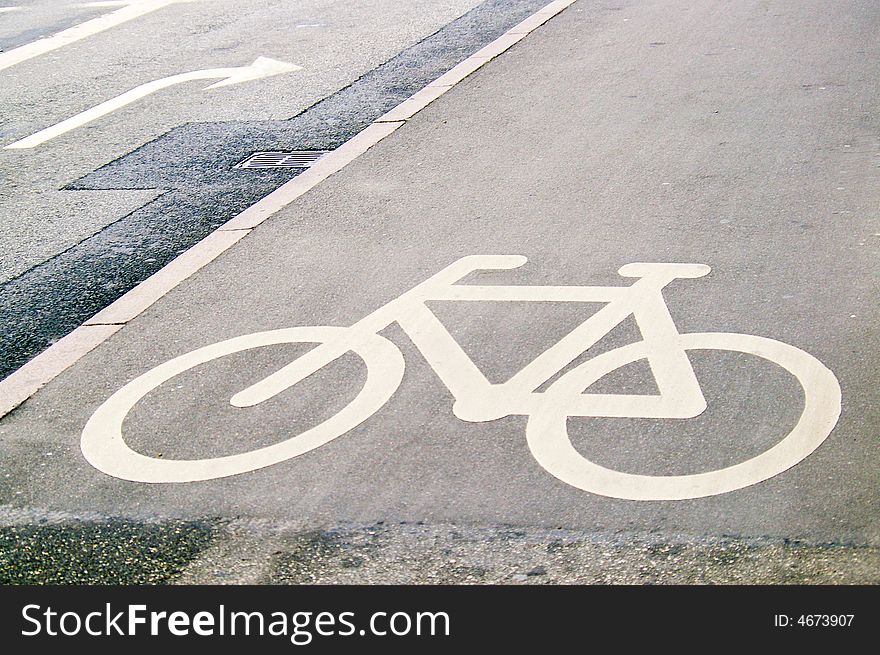 White bicycle sign on the road. White bicycle sign on the road