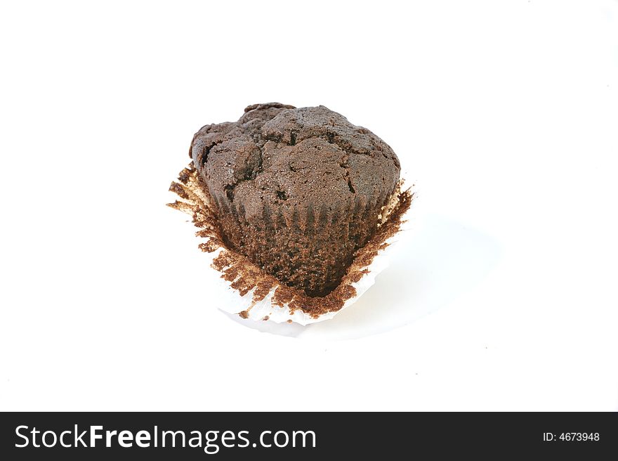 Chocolate muffin in muffin case with the front peeled.