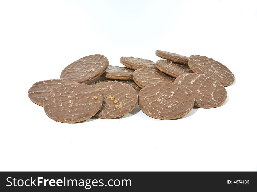 Pile of Chocolate Biscuits on a white background.