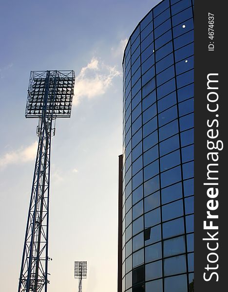 Silhouette of floodlights against on a stadium